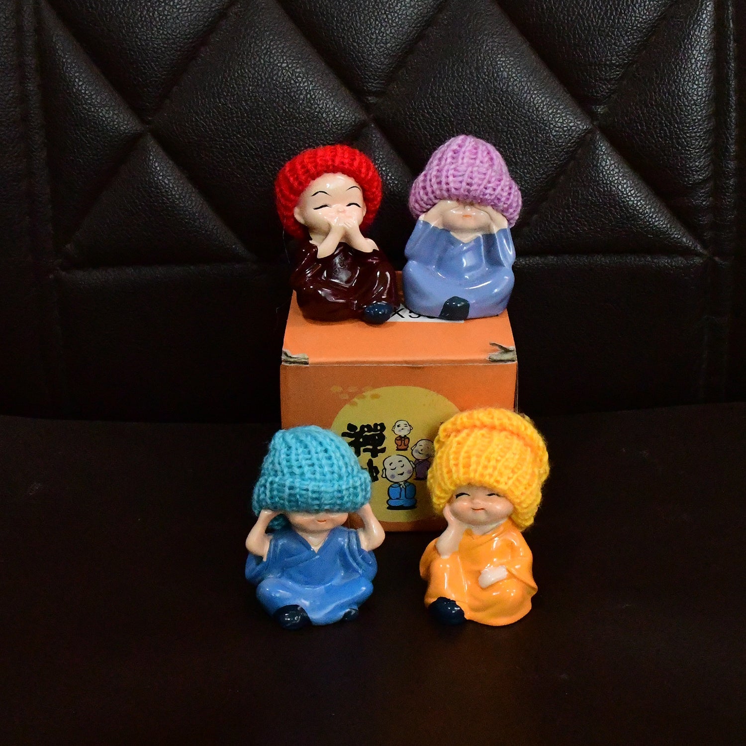Decorative Resin Monk Buddha Showpiece Set of 4 with Traditional Straw Hats Decorative Resin Monk Buddha Showpiece Set of 4 with Traditional Straw Hats